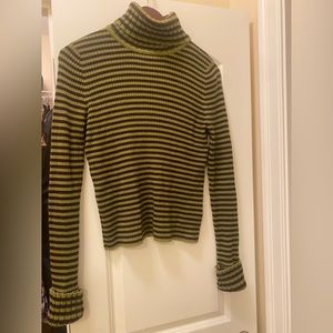 Turtle neck made from wool, not scratchy, very nice to the skin.Wore once
